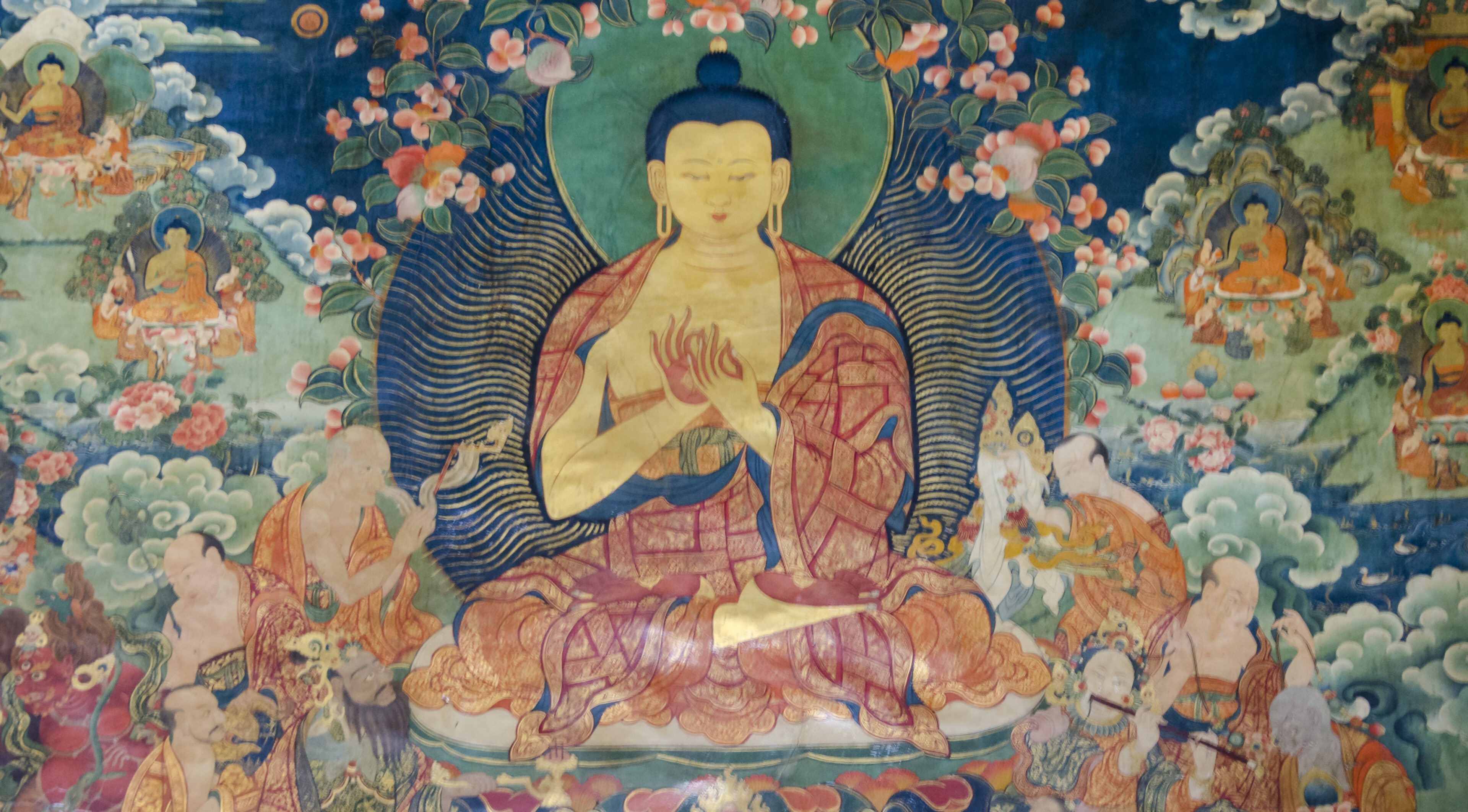Ancient Buddha painting with serene expression and detailed floral background.